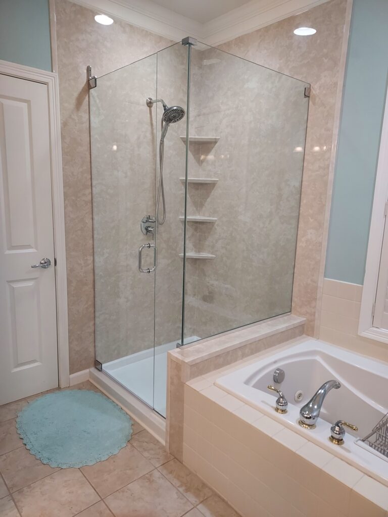 glass enclosed shower with marble